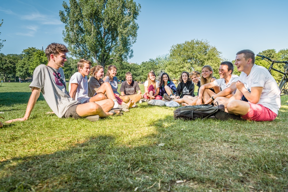Students sitting together on the grass